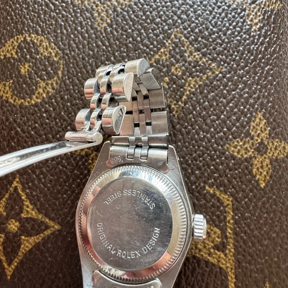Rolex Silver Watch with White Dial and Diamond Bezel